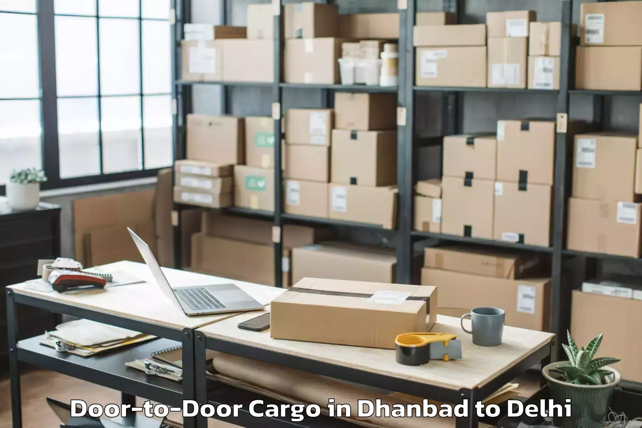 Expert Dhanbad to Defence Colony Door To Door Cargo